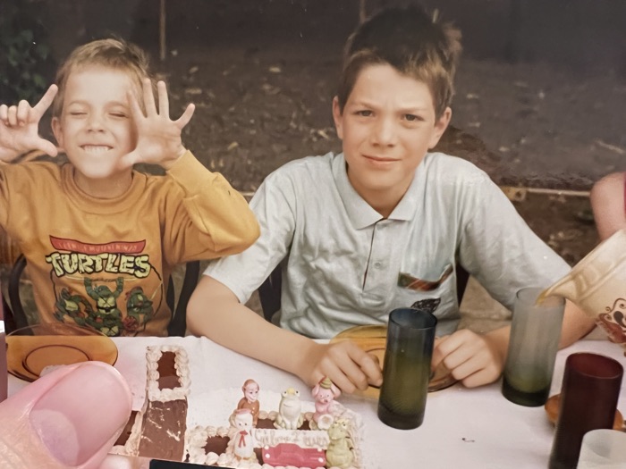 Archival photo: two boys at a table