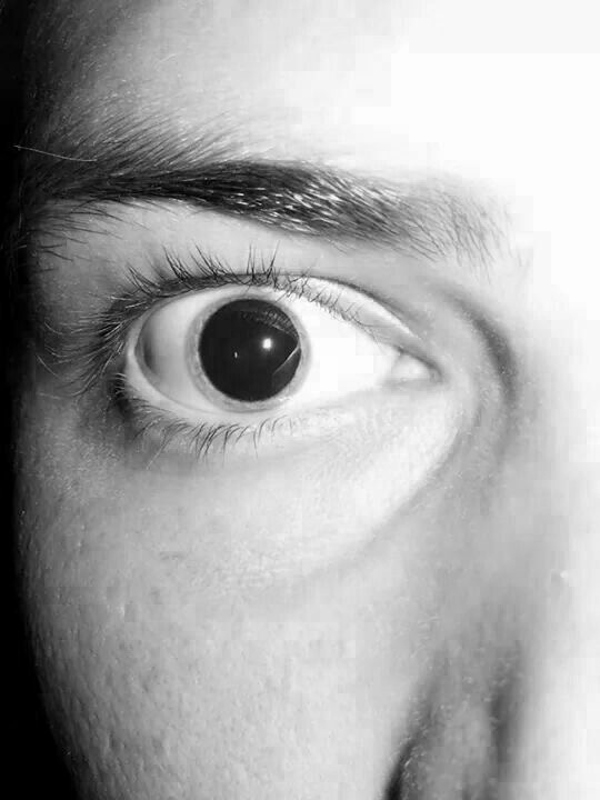 Extreme close-up of a wide, staring eye