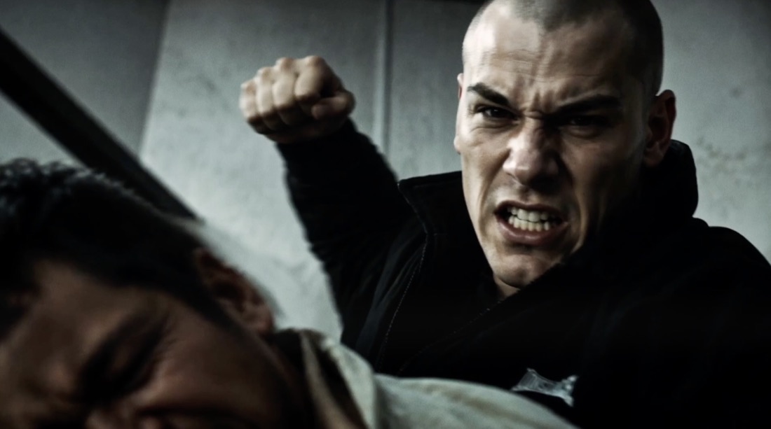 A skinhead throwing a punch