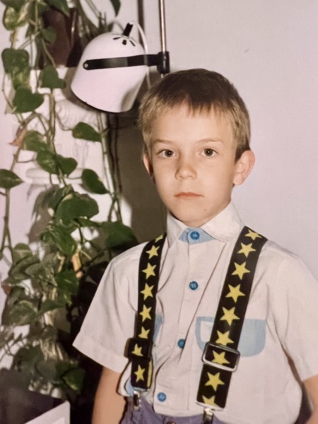 Gabriel as a small boy in star-print braces