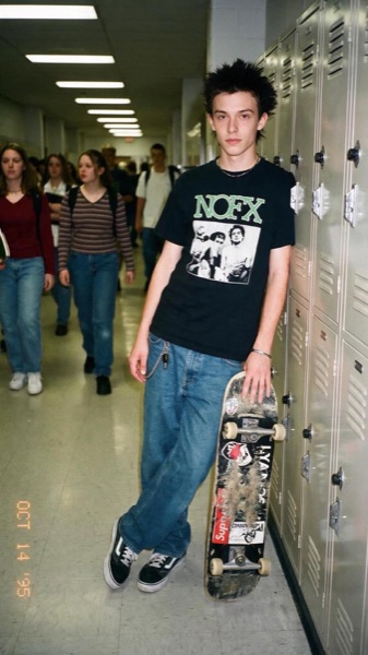 Gabriel as a punk skater in a school corridor